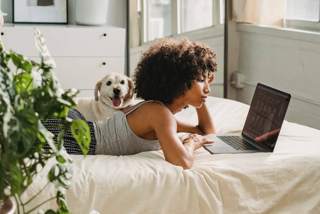 owner and pet in bed